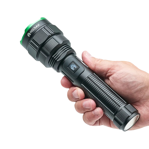 Hand holding black Kodiak tactical flashlight with green bezel and textured grip for tools and home improvement use
