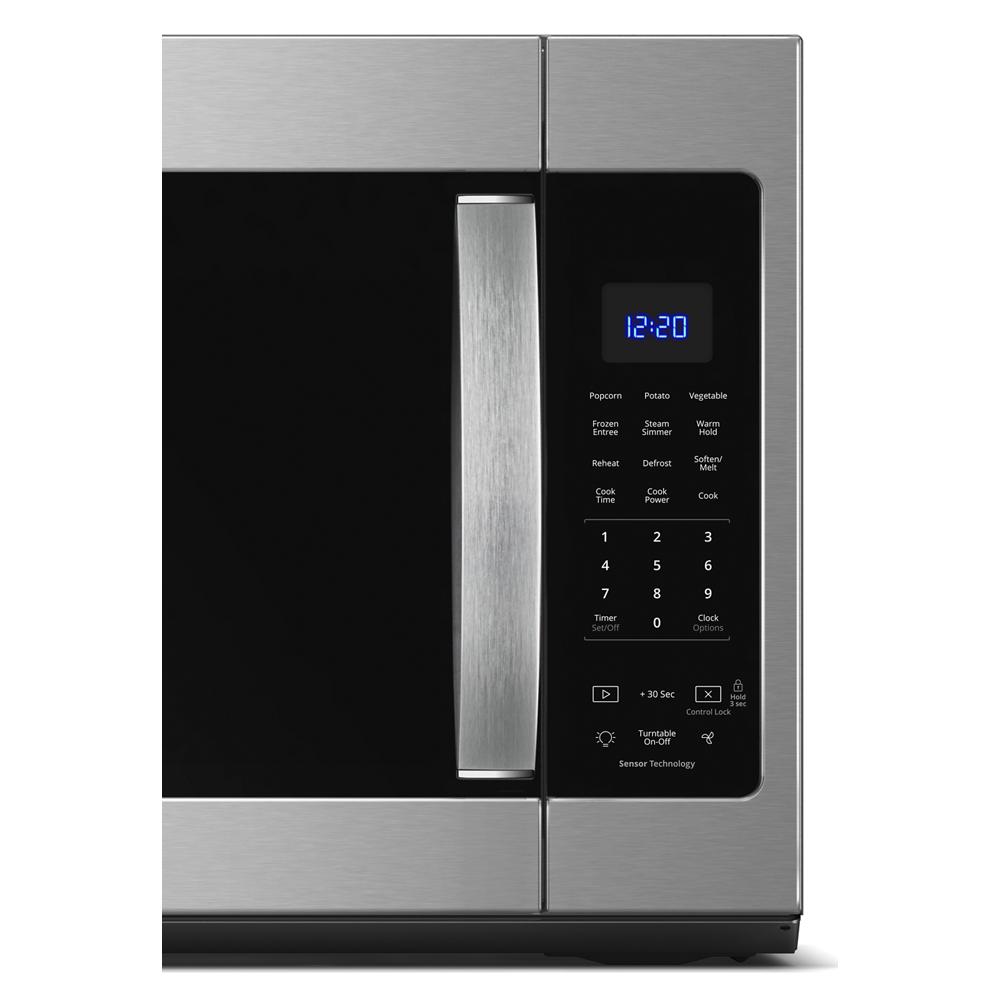 Close-up view of stainless steel microwave door handle and digital control panel with sensor cooking functions in kitchen appliances