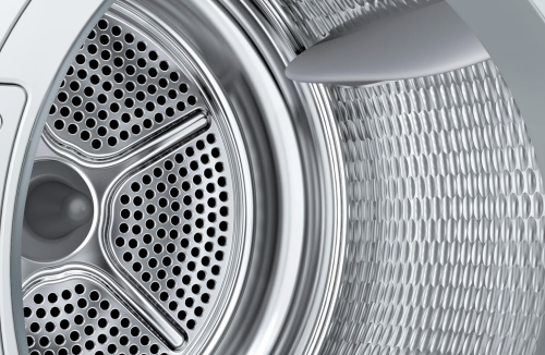 Close-up view of stainless steel drum interior in a Bosch 500 Series heat pump dryer from appliances collection