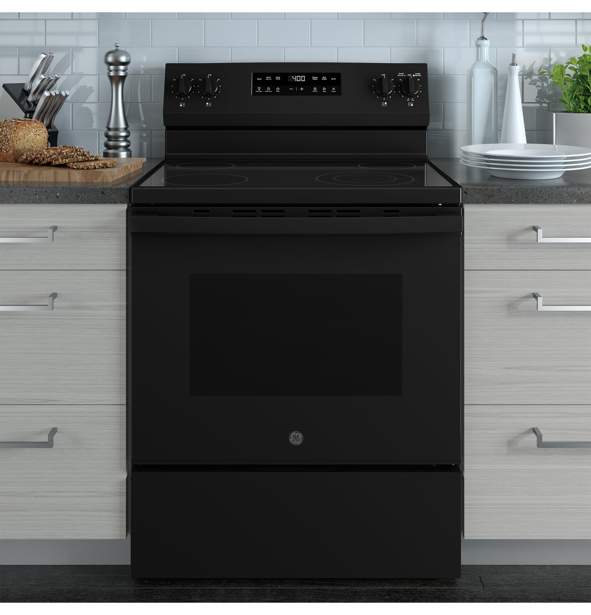 Black free-standing electric range with smooth cooktop and digital clock controls in modern kitchen setting