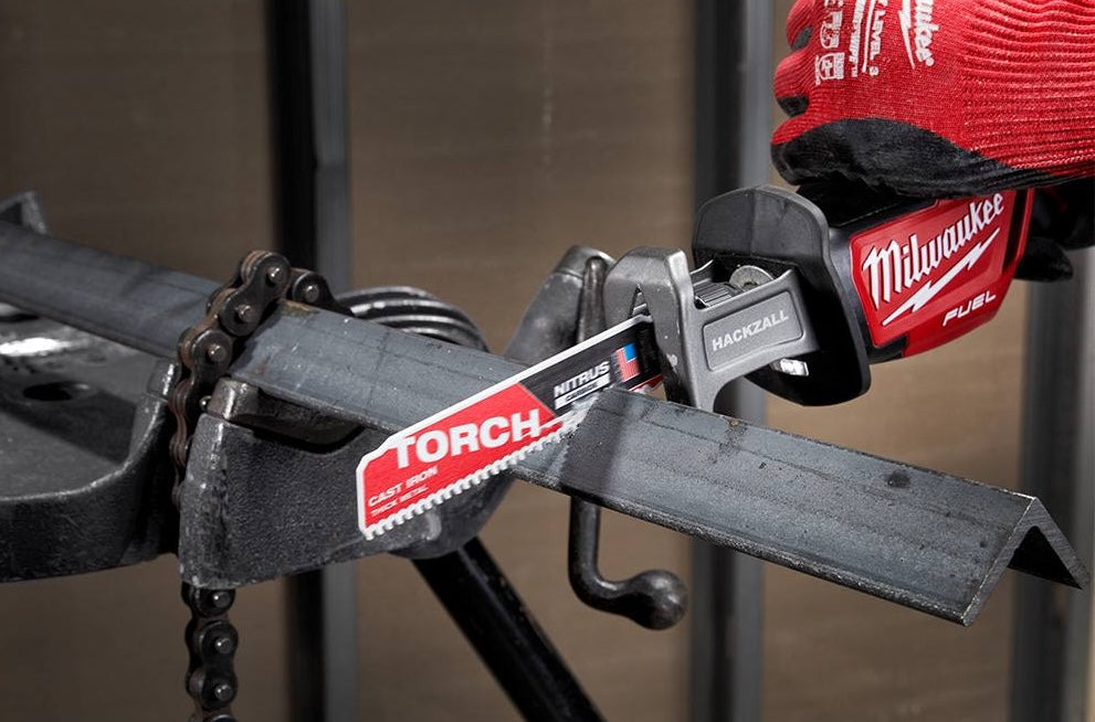 Milwaukee sawzall cutting thick steel tubing with carbide blade, part of power tool accessories collection