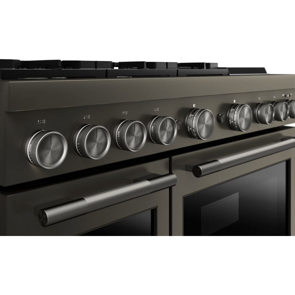 Close-up of matte black dual oven range control panel with eight brushed metal knobs in kitchen appliance setting