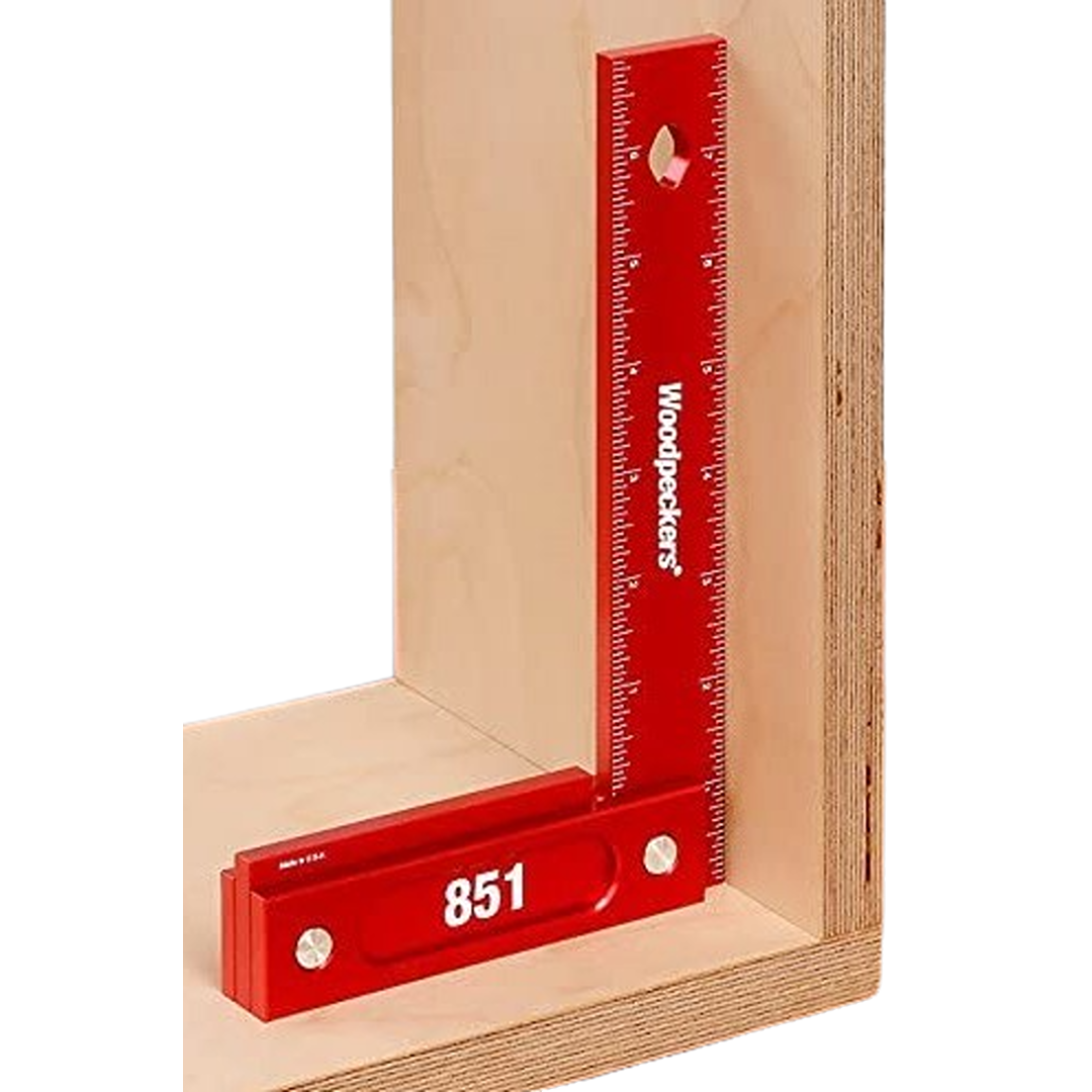 Red aluminum precision square with white engraved measurement markings used for accurate woodworking and home improvement projects