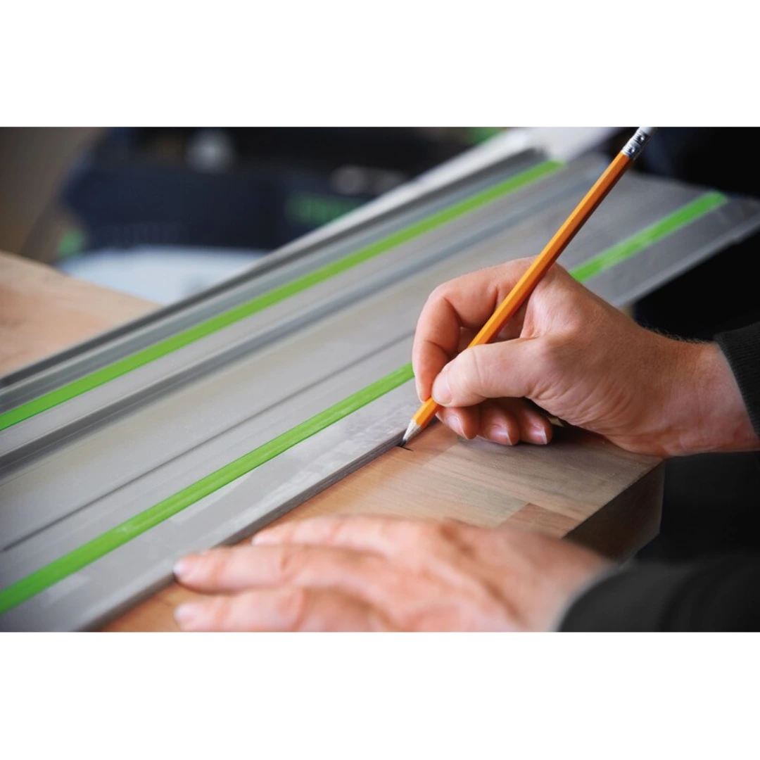 Person marking wood edge using a Festool guide rail with splinterguard in woodworking tool accessories collection