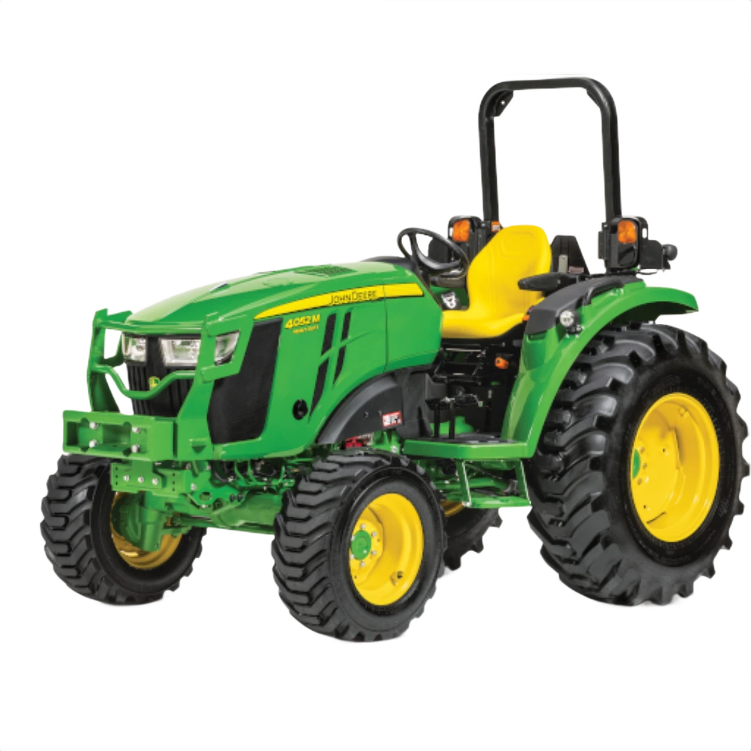 Front three-quarter view of a green and yellow compact tractor with rugged tires and open operator station, featured in Outdoor Power Equipment at Hartville Hardware