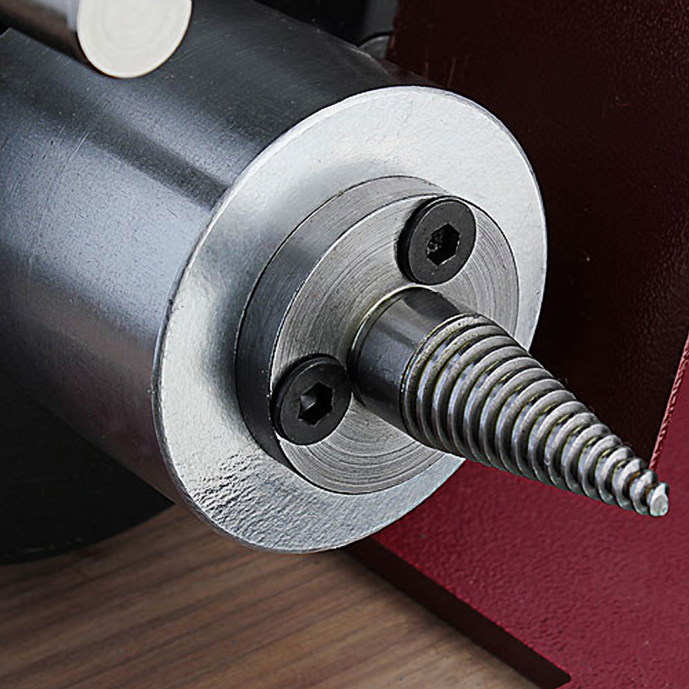 Close-up of a metal pigtail mandrel with threaded tip for woodturning in tools and home improvement projects