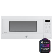 White GE Profile microwave oven with digital keypad and timer display in kitchen appliances collection