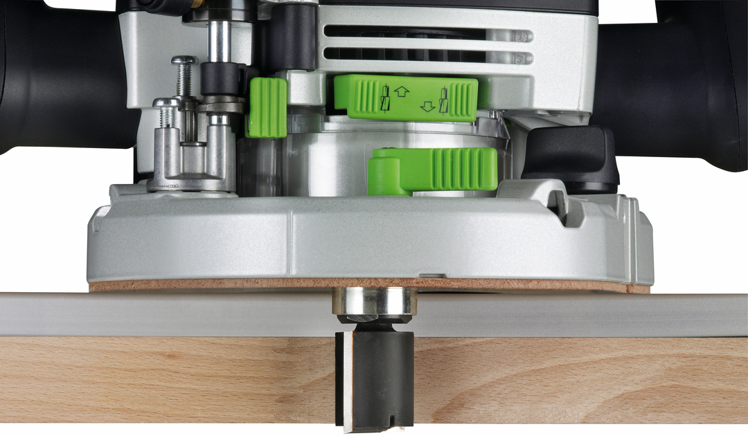 Close-up of Festool router bit cutting precisely into wood with visible green adjustment controls in woodworking tools collection