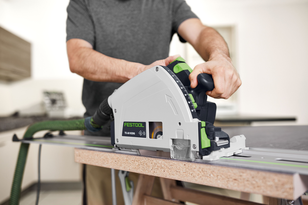 User adjusting depth setting on Festool plunge cut track saw for accurate cutting in electric power tools collection