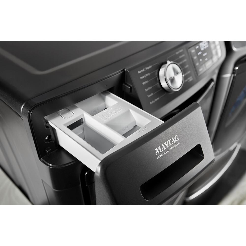 Black front load washer with open detergent drawer and digital controls from washers and appliances collections