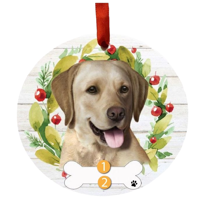 Round Christmas ornament with yellow labrador face and festive green and red wreath for holiday decorations
