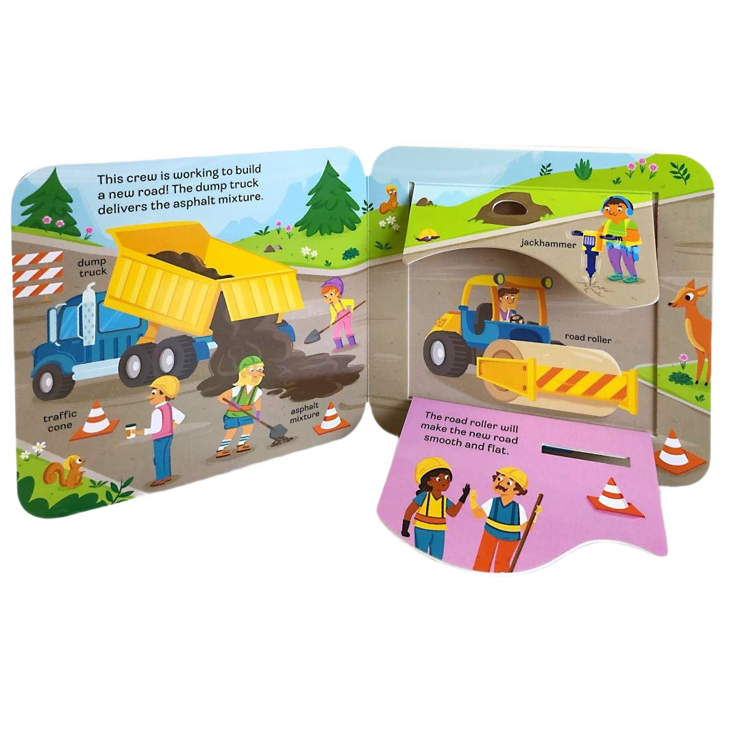 Colorful children’s board book spread showing construction vehicles and workers building a road with interactive flaps