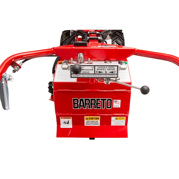 Rear view of a durable red heavy-duty tiller with hydraulic controls and large treaded rear tires, featured in rental equipment at Hartville Hardware.