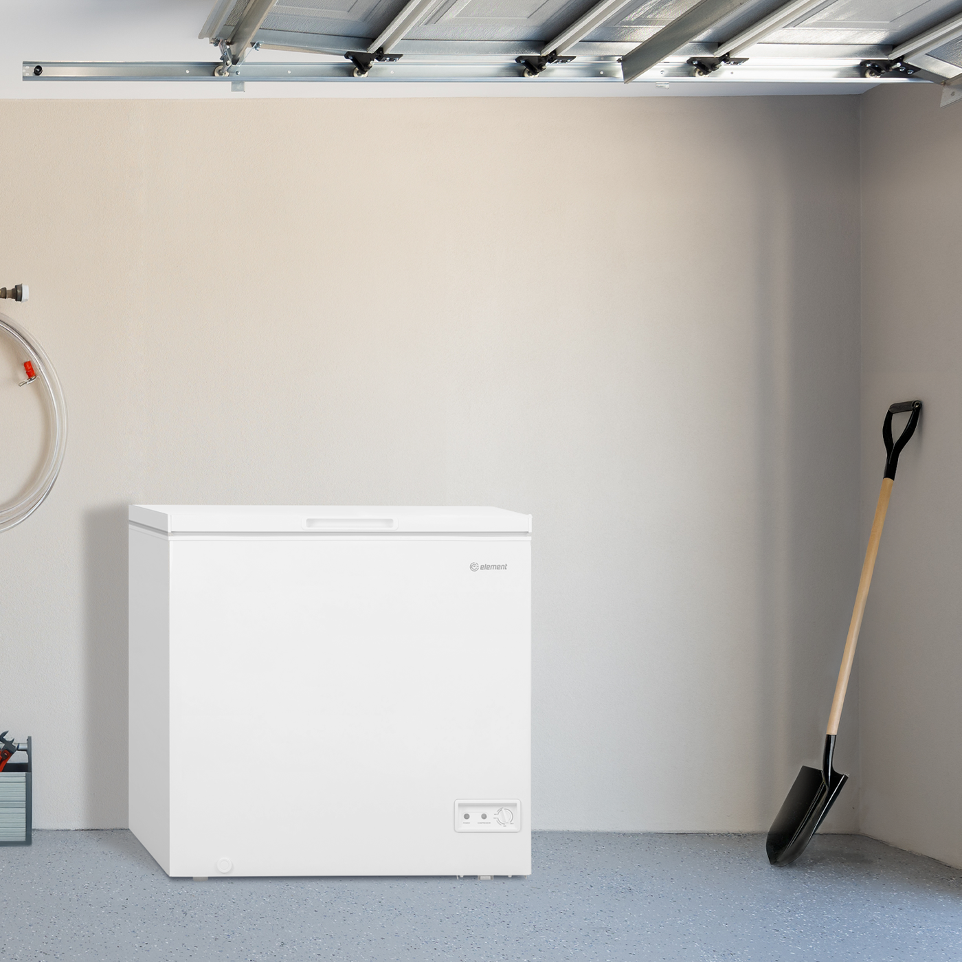 White 7.0 cubic foot chest freezer in garage setting for extra kitchen and appliance storage use