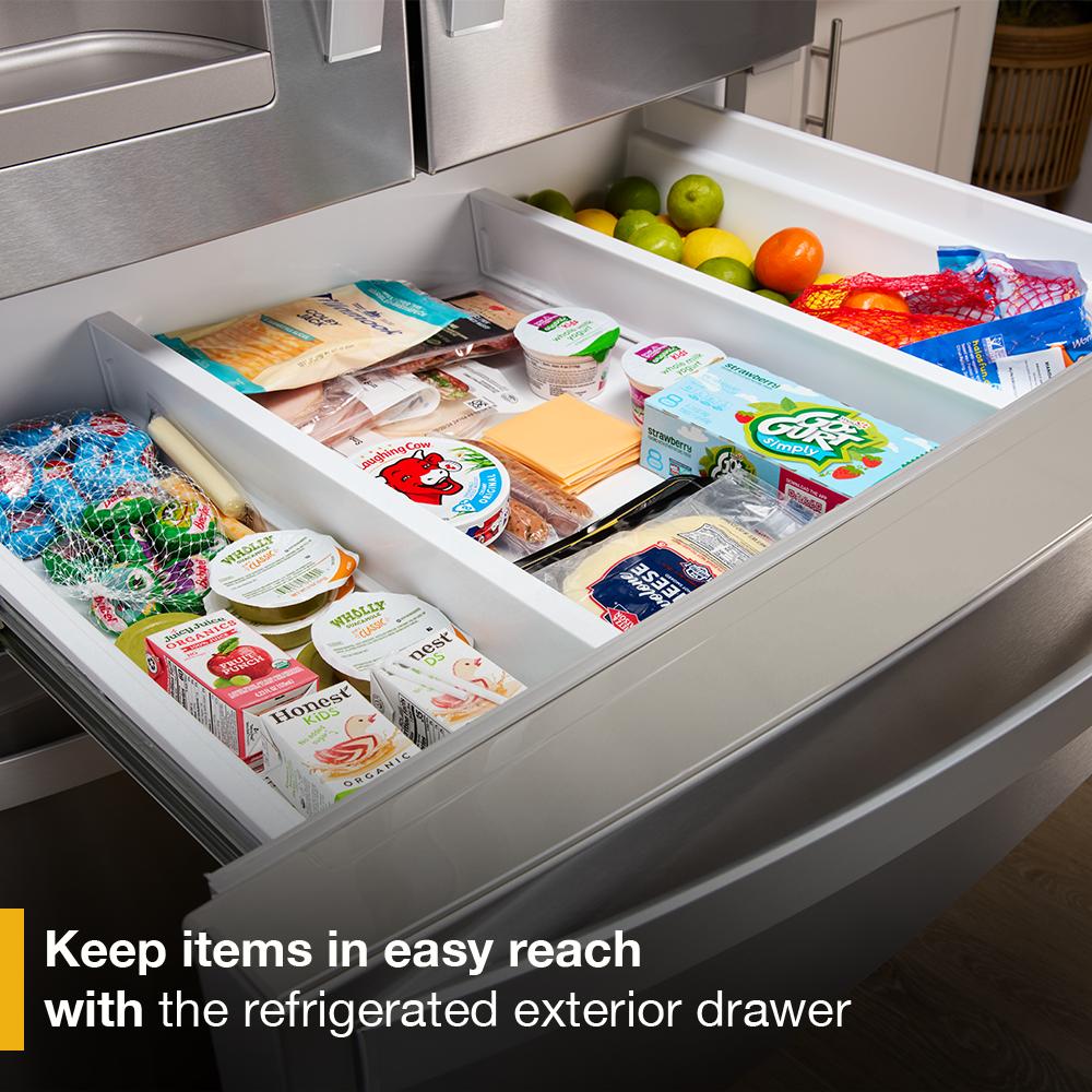 Refrigerated exterior drawer open with fresh fruits, snacks, and beverages in kitchen appliances collection