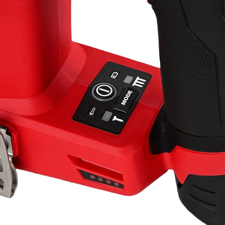 Close-up of red cordless brad nailer control panel with mode selector and LED indicator for home improvement tools