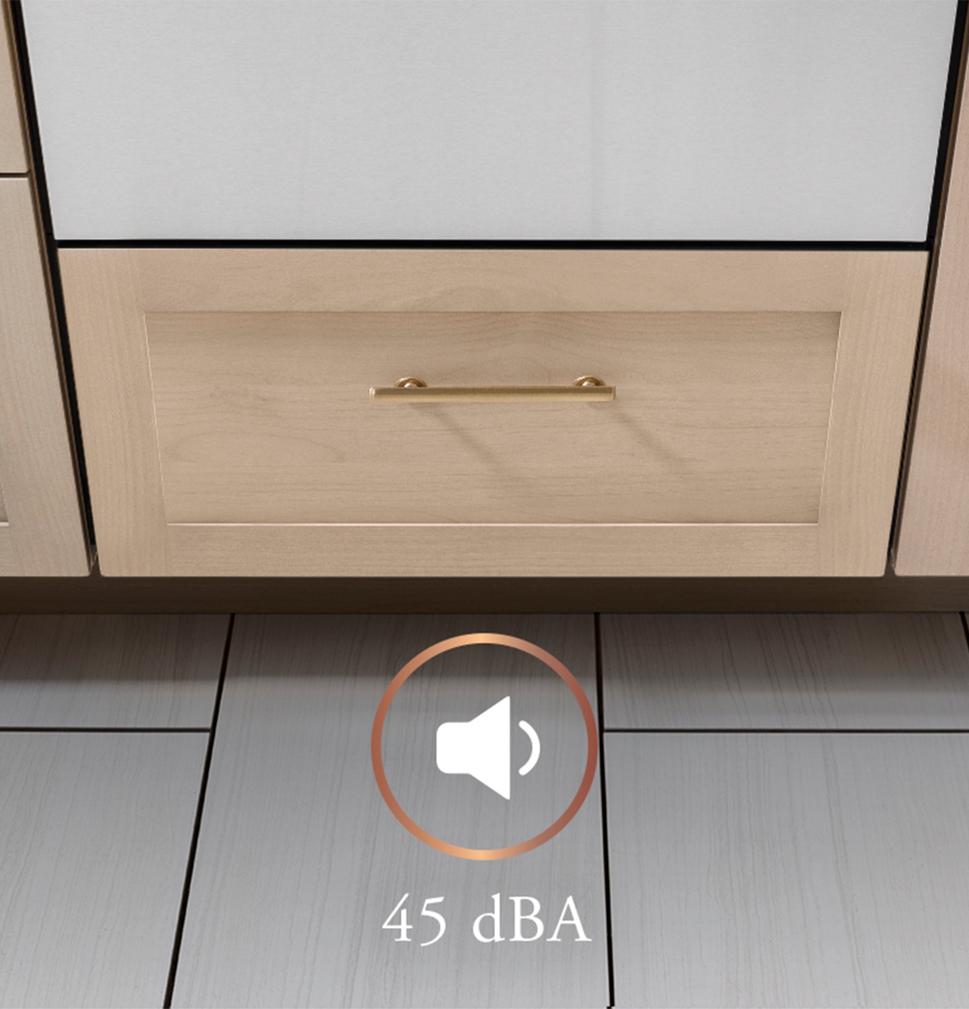 Closed single drawer dishwasher integrated into light wood kitchen cabinetry on tiled floor with sound level icon