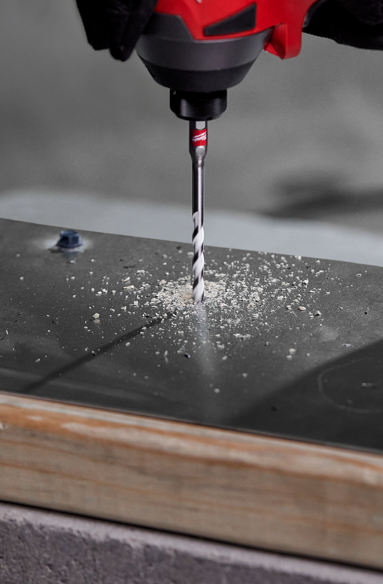 1/8 inch carbide multi-material drill bit in power tool drilling through metal for home improvement tasks