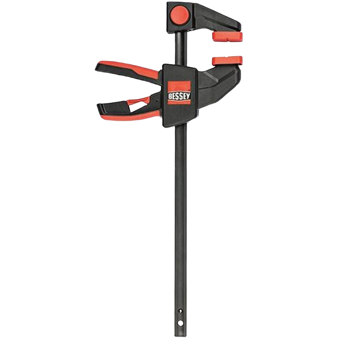 Black and red trigger clamp with ergonomic handle and padded jaws for precise hold in woodworking projects