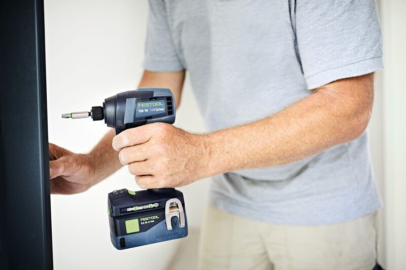 Person using Festool cordless impact driver with Phillips head bit on home improvement project
