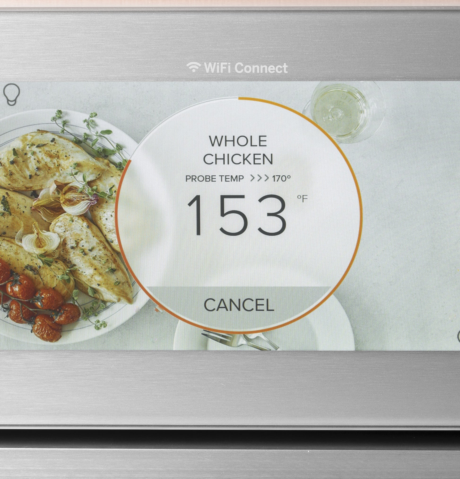 Close-up of smart wall oven touchscreen showing whole chicken cooking with temperature probe and WiFi connect icon