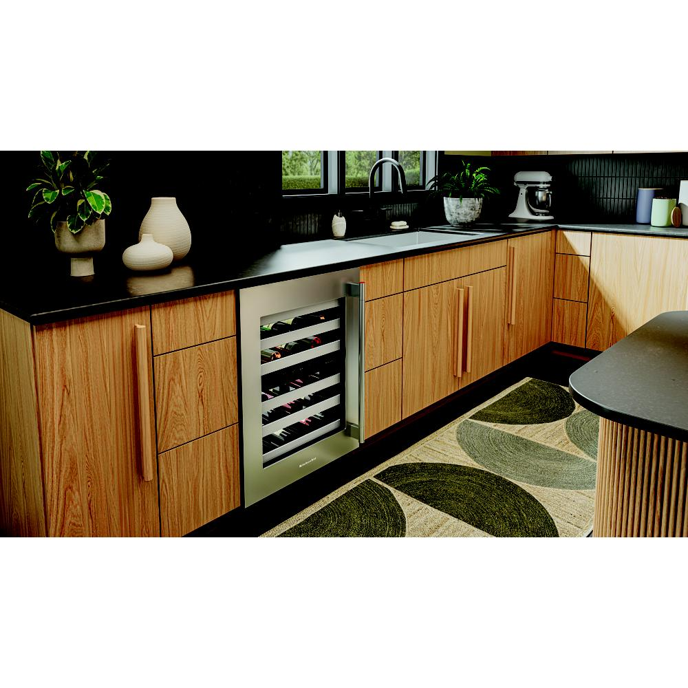 Built-in undercounter wine cellar with full-extension metal racks and stainless steel frame in modern kitchen setting