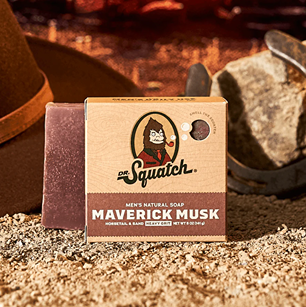 Brown natural bar soap with Dr. Squatch branding and Maverick Musk label on textured kraft paper packaging