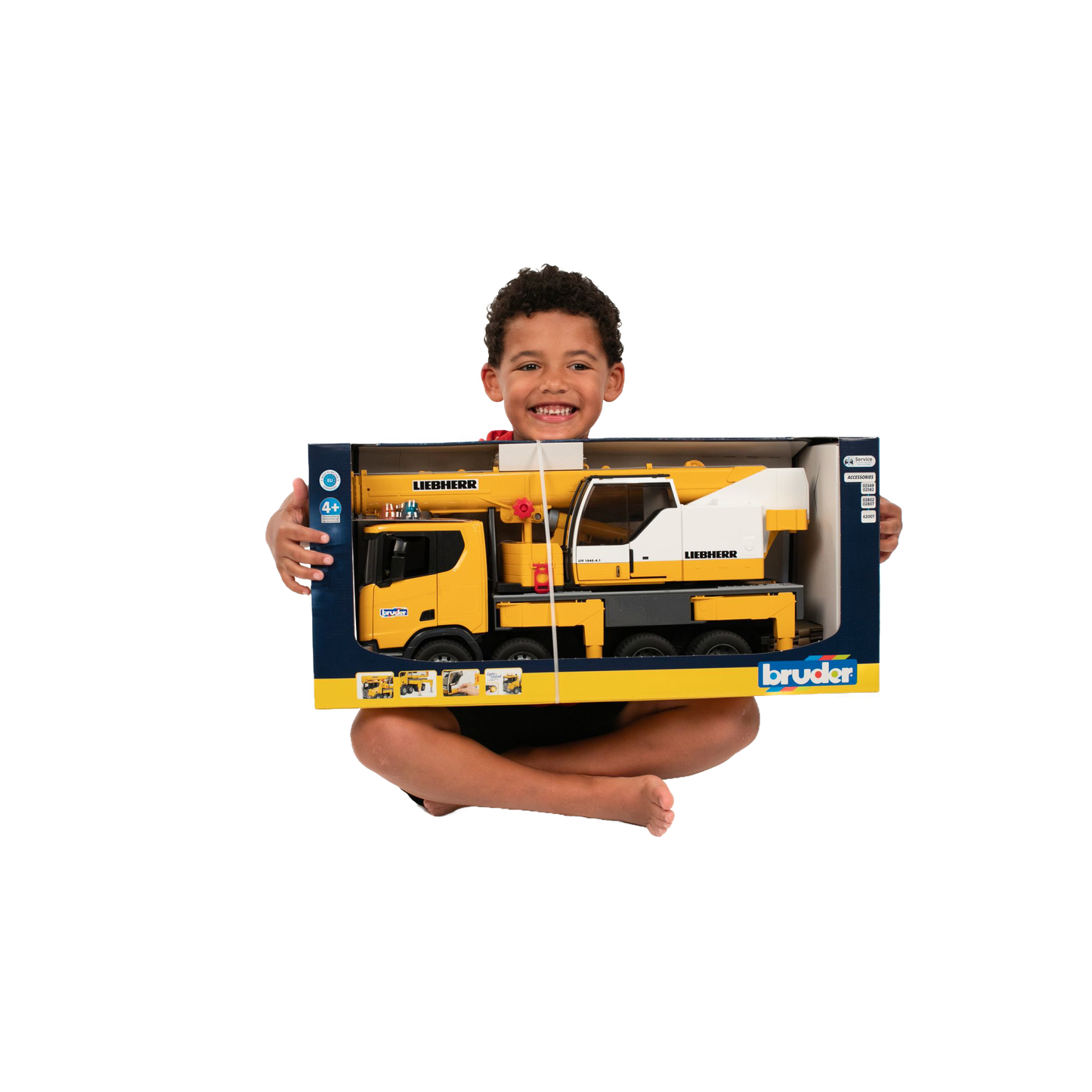 Child holding Bruder Scania Super 560R Liebherr crane truck toy with light and sound from Vehicles & Remote Controlled Toys collection