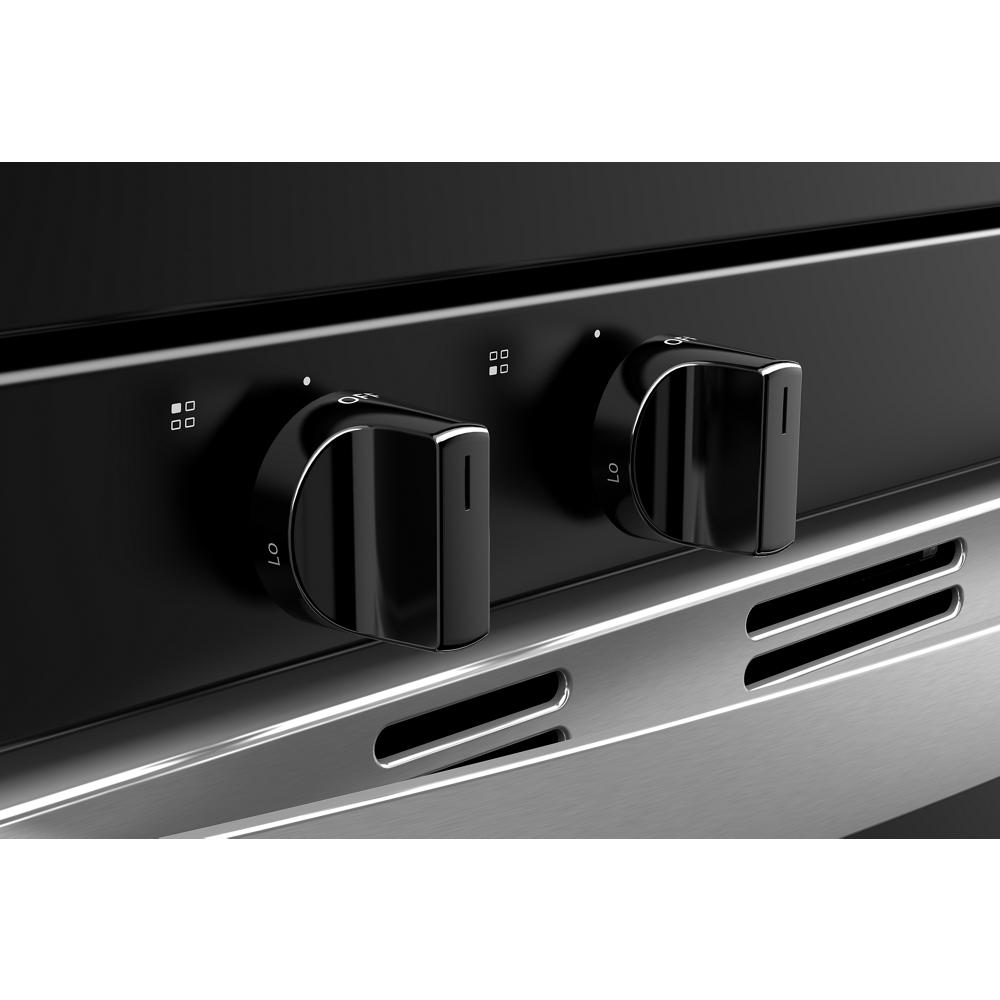 Close-up of black control knobs on a stainless steel gas range from Ranges and Kitchen & Kitchenware collections