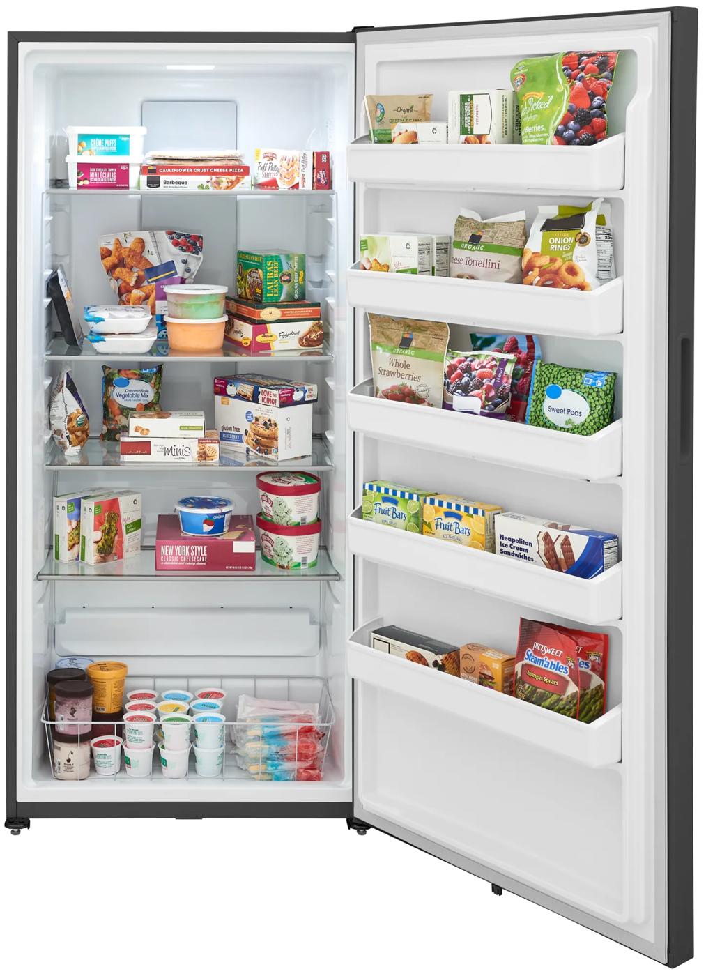 Open upright freezer with organized frozen food items on multiple shelves and door bins in home appliance setting