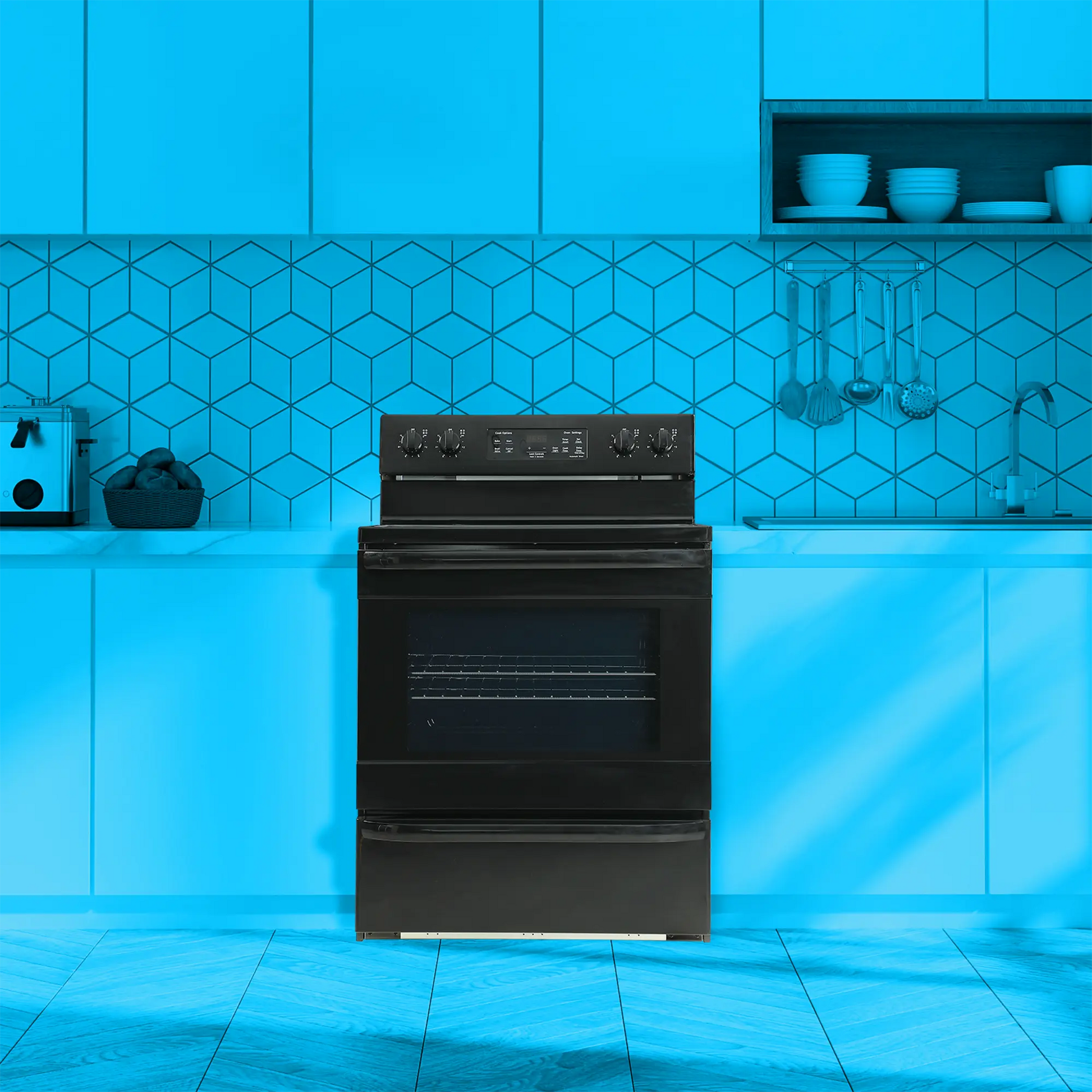 black electric range with four burner cooktop and digital controls in modern kitchen with blue cabinetry