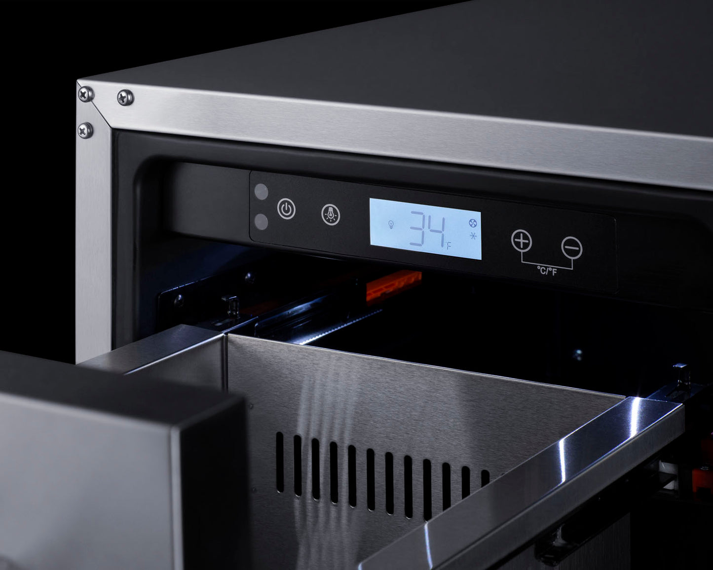 Digital temperature control panel displaying 34 degrees on stainless steel two-drawer refrigerator in kitchen setting