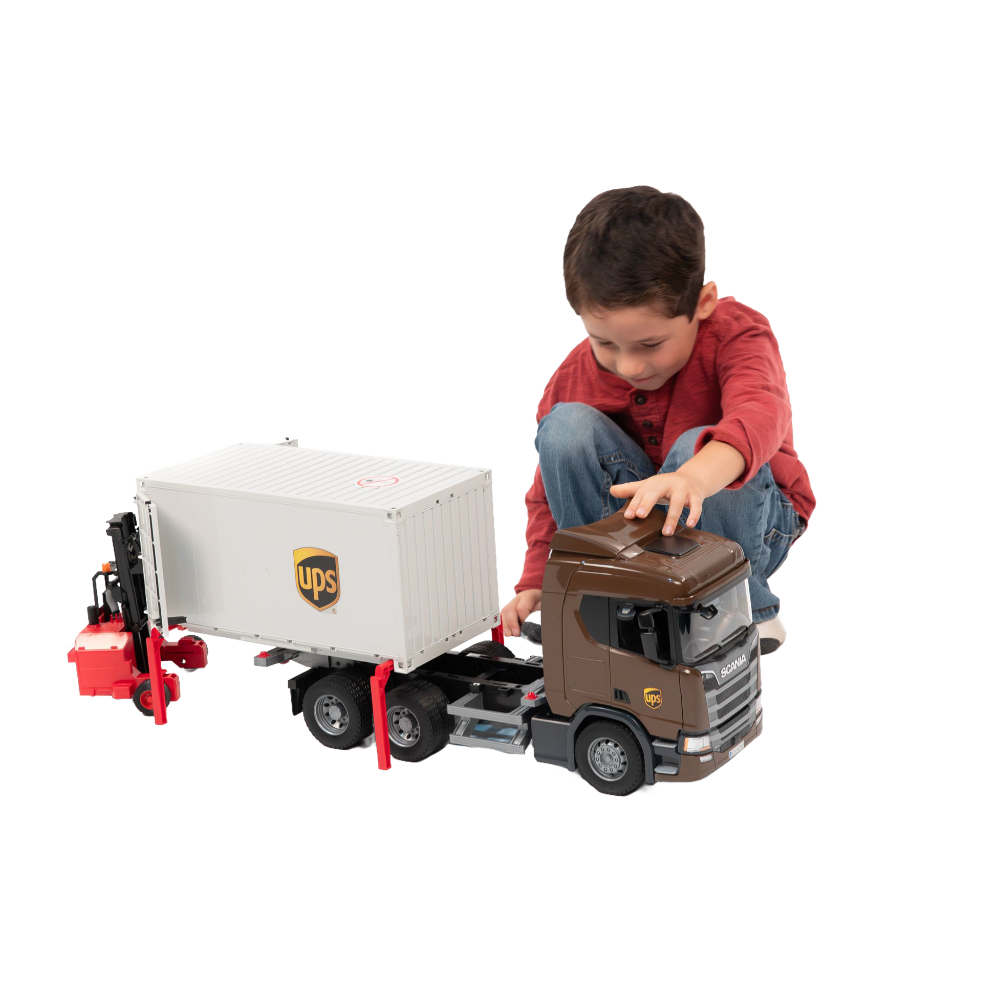 Child playing with detailed brown and white UPS logistics toy truck and red forklift from Bruder Toys collection
