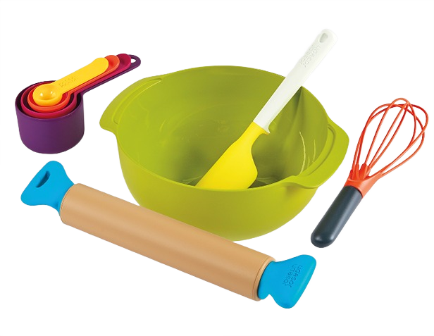 Green mixing bowl with yellow spatula, orange whisk, blue-handled rolling pin, and colorful measuring spoons set