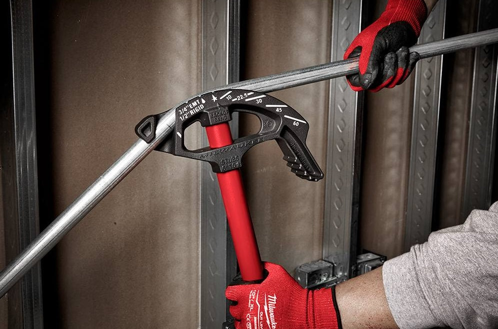 Red iron conduit bender with high contrast angle markings bending EMT pipe for electrical hand tools and home improvement tasks
