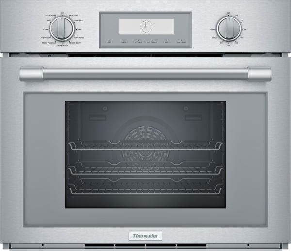 Stainless steel wall oven with dual control dials and digital display in kitchen and appliances collection