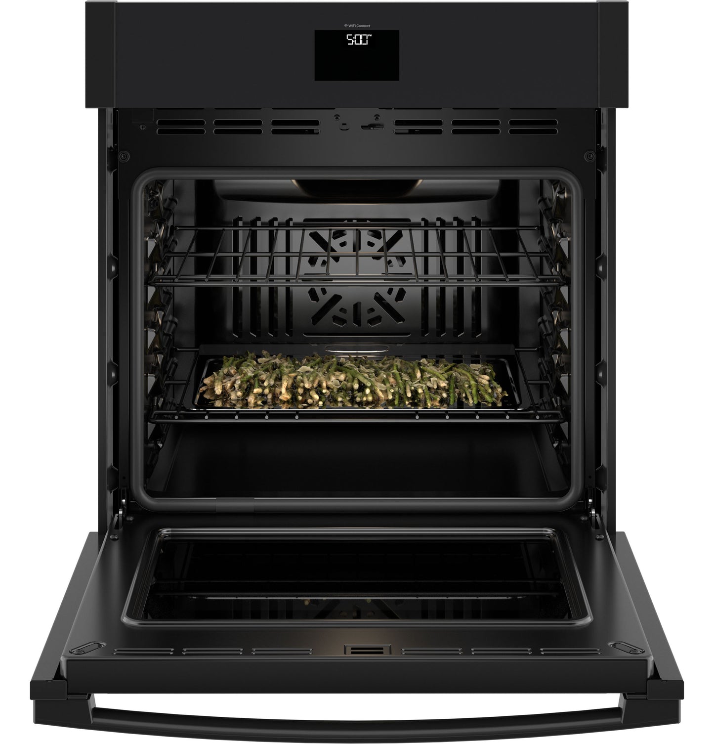 Open black built-in convection wall oven with tray of roasted vegetables inside from kitchen appliances collection