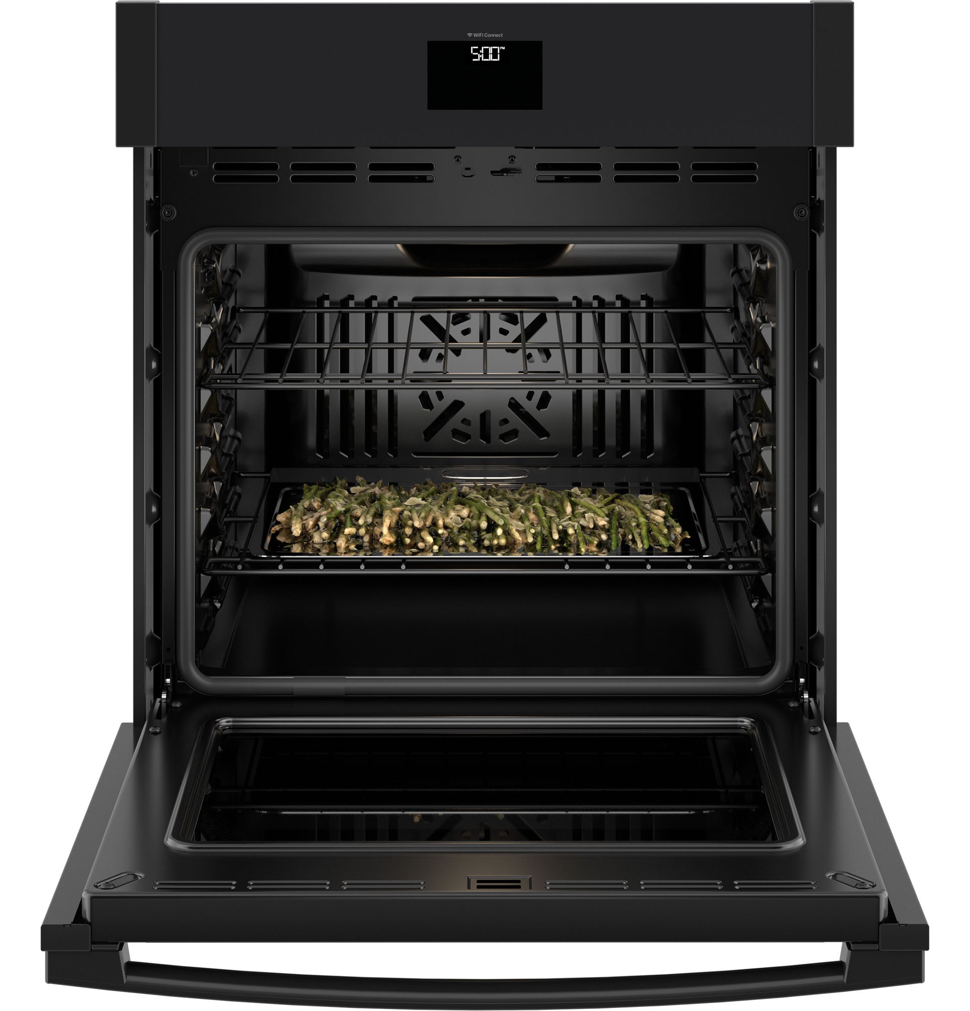 Open black built-in convection wall oven with tray of roasted vegetables inside from kitchen appliances collection