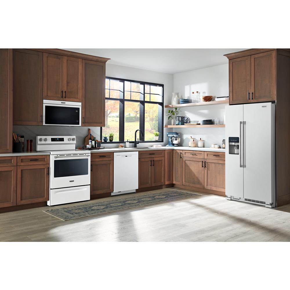 Modern kitchen with white front control dishwasher, wooden cabinets, and stainless steel appliances in appliances collection