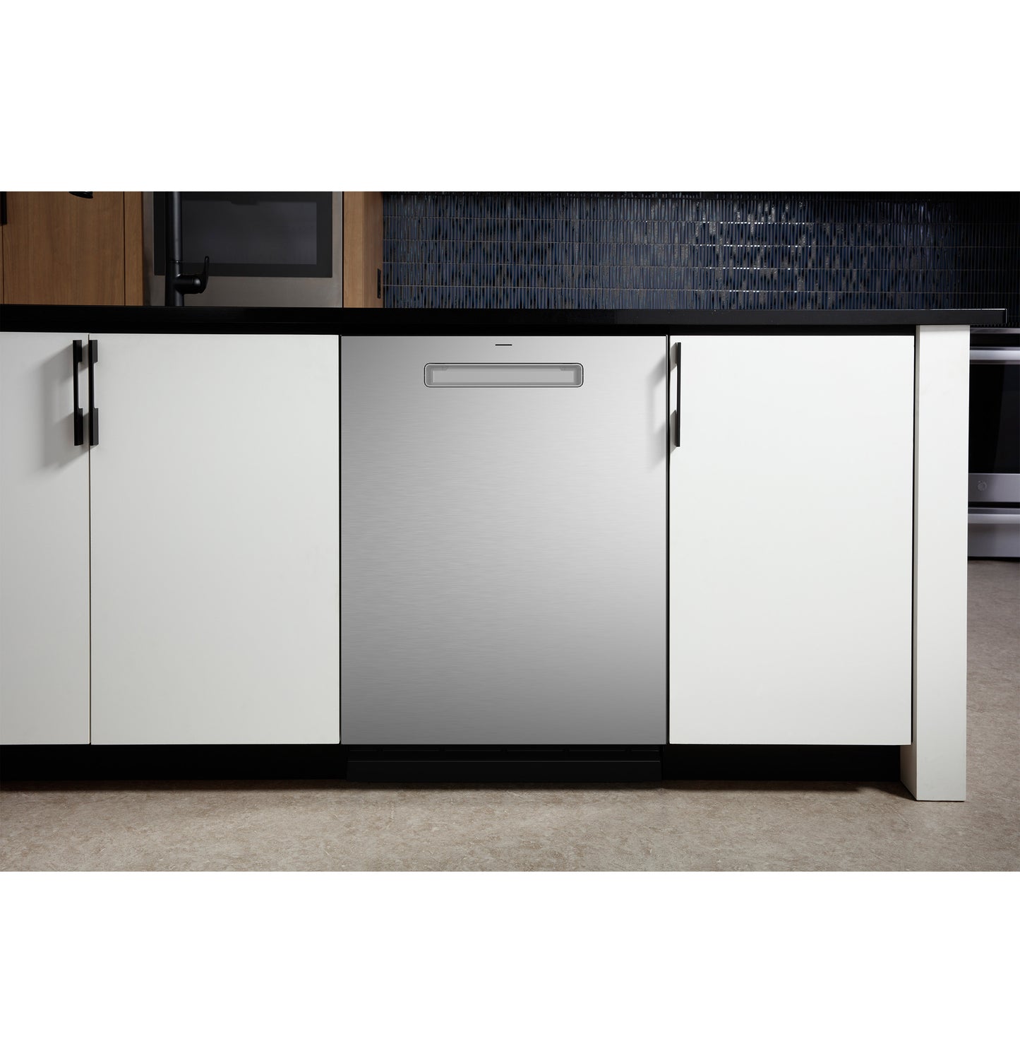 Built-in stainless steel dishwasher with discreet handle integrated into modern white kitchen cabinetry in appliance setting