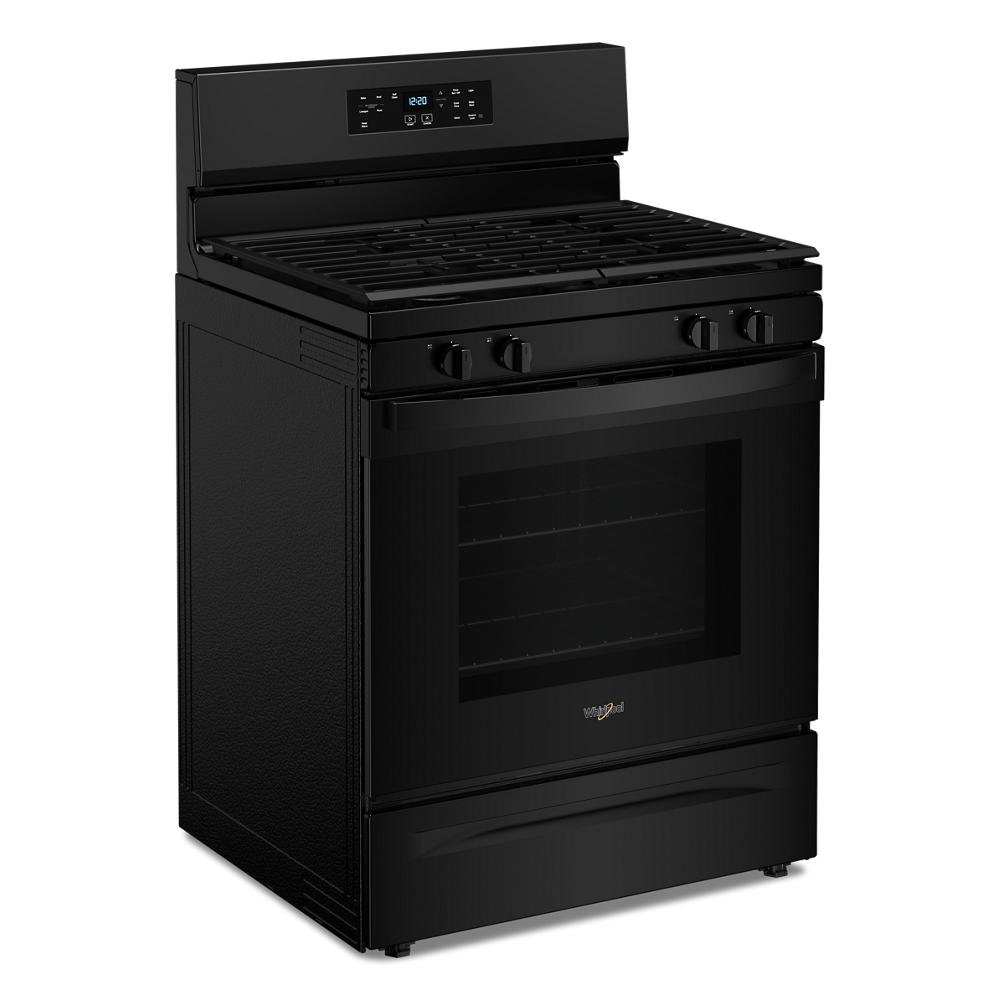 Modern black freestanding gas range with digital control panel and four burner grates in kitchen appliance setting