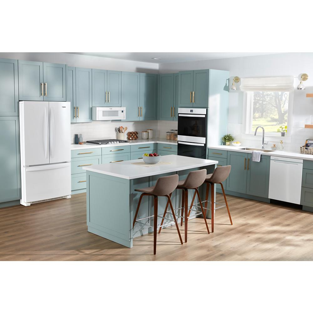 Modern kitchen with pastel blue cabinetry, white appliances, kitchen island with seating, and wood flooring in kitchenware collection