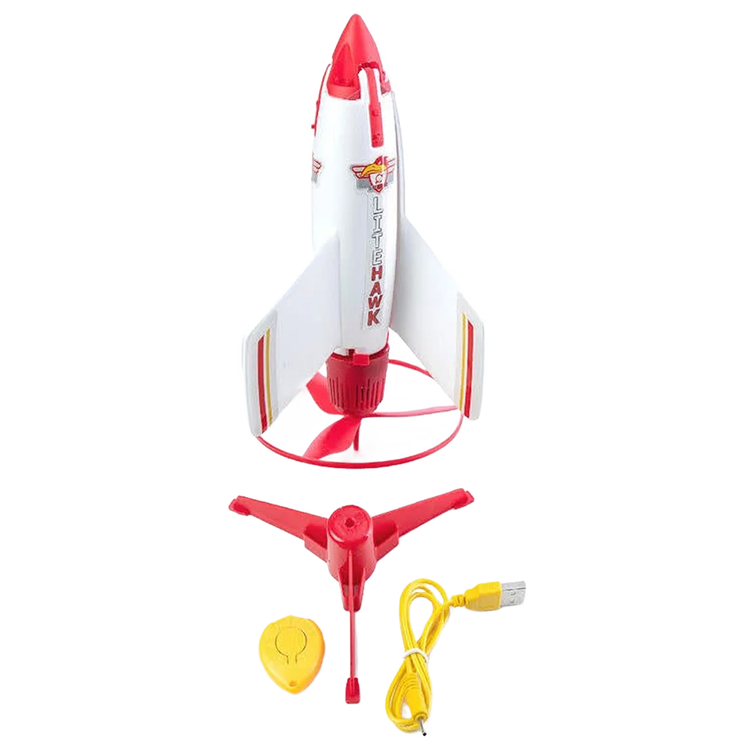 Red and white battery powered RC rocket with stand, USB charging cable, and remote control for outdoor play