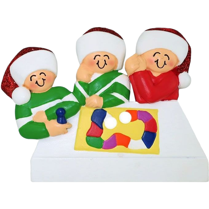 Festive ornament showing three smiling figures in holiday hats playing a colorful board game under $50 collection