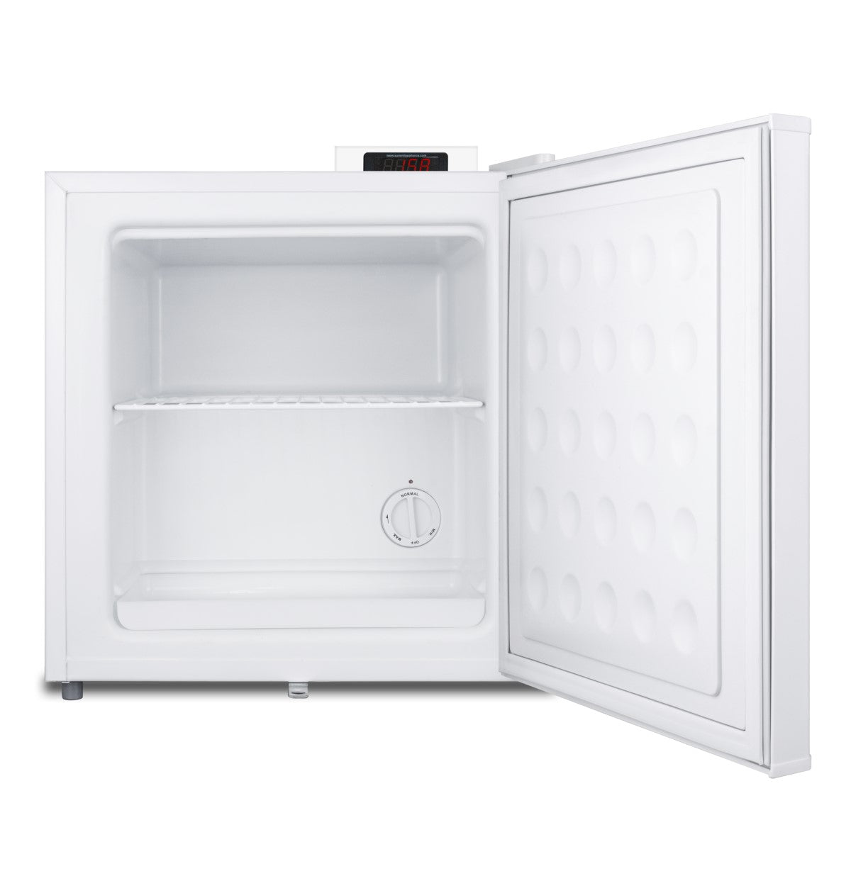 Compact white upright freezer with open door, interior wire shelf, and temperature control dial from freezer collection