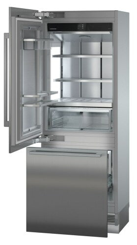 Open stainless steel built-in refrigerator-freezer with adjustable shelves and clear vegetable drawer in kitchen appliances collection