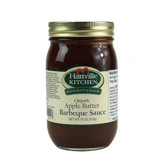 Glass jar of Hartville Kitchen chipotle apple butter barbeque sauce in sauces and grilling collections