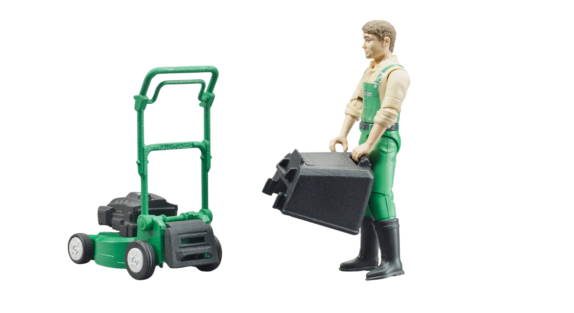 Figure in green dungarees holding grass box next to green push mower toy in Bruder Toys and under $50 collections