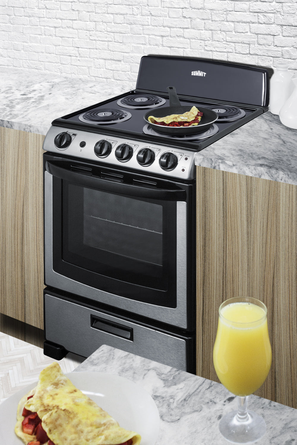 24" wide electric coil range with stainless steel finish in modern kitchen setting with omelet cooking on stovetop