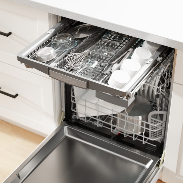 Open 24-inch white dishwasher with cutlery tray and lower rack filled with pots and kitchen utensils from Bosch appliances collection